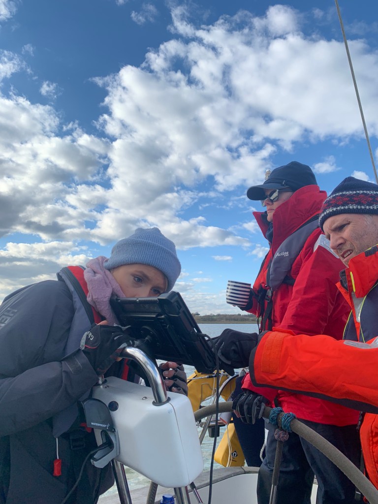 Emma, Michelle and me, consulting Navionics on the River Deben
